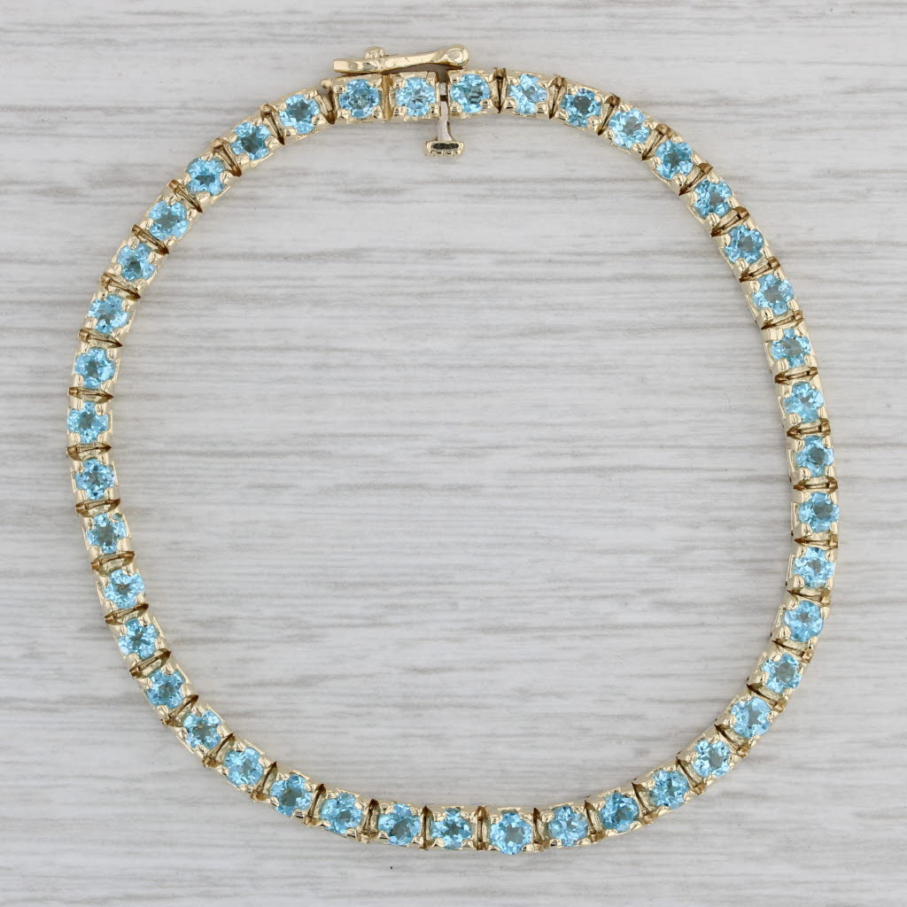 Gray 5.70ctw Blue Topaz Tennis Bracelet 14k Yellow Gold 7" 3.6mm