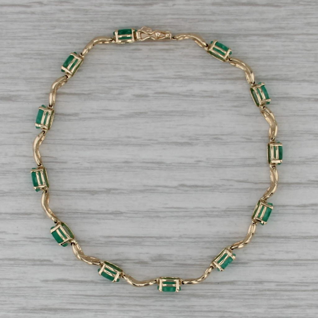 5.65ctw Emerald Tennis Bracelet Inifinity Links 14k Yellow Gold 7.25" 4.9mm