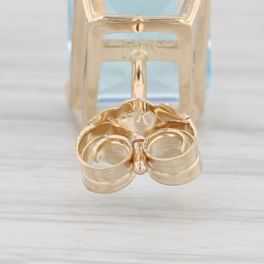 Light Gray 6ctw Blue Topaz Stud Earrings 14k Yellow Gold Emerald Cut Solitaires