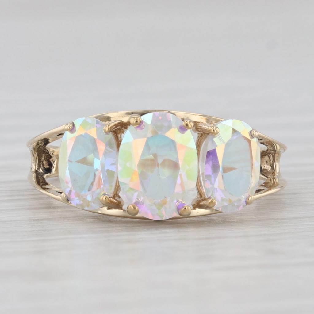 Light Gray 3.50ctw Oval Mystic Topaz 3-Stone Ring 10k Yellow Gold Size 7