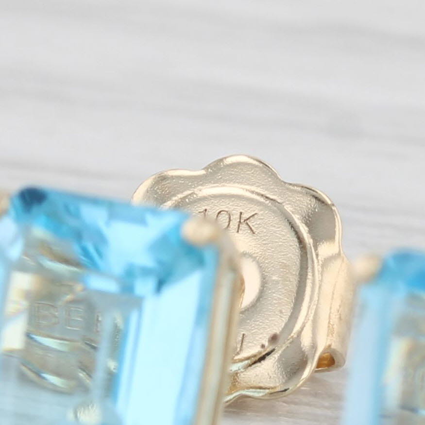 Light Gray 4ctw Blue Topaz Stud Earrings 10k Yellow Gold Emerald Cut Solitaires
