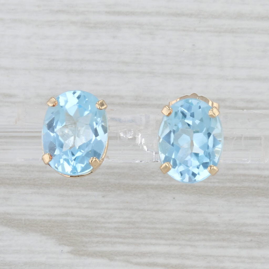4.30ctw Oval Blue Topaz Stud Earrings 14k Yellow Gold Solitaire Studs
