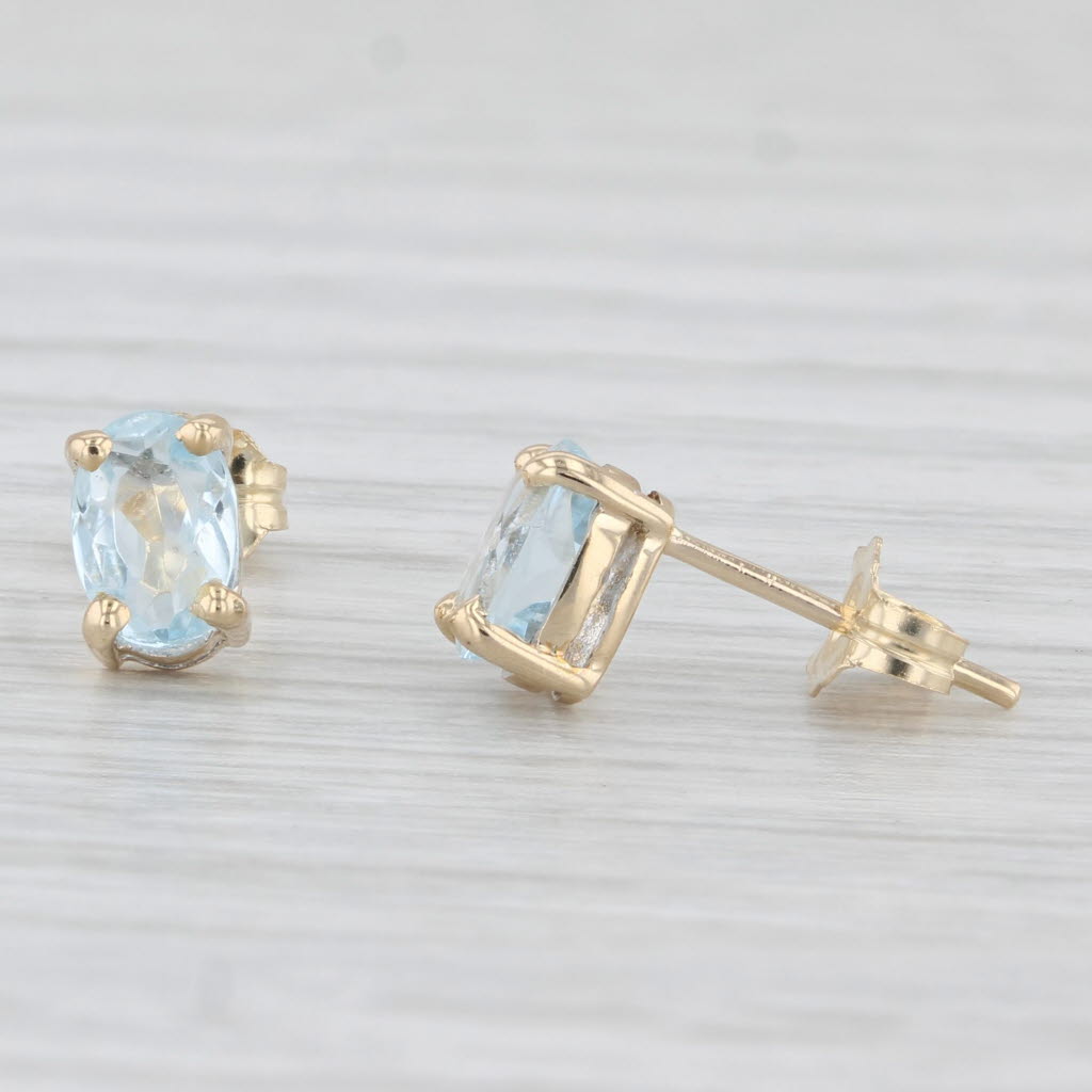 Light Gray 0.80ctw Aquamarine Stud Earrings 14k Yellow Gold Oval Solitaires