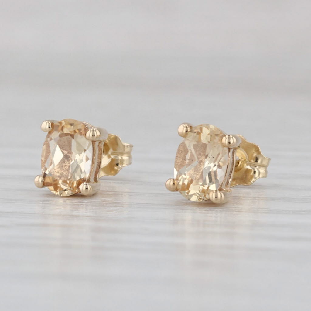 1.07ctw Yellow Topaz Stud Earrings 10k Yellow Gold Oval Solitaire Studs