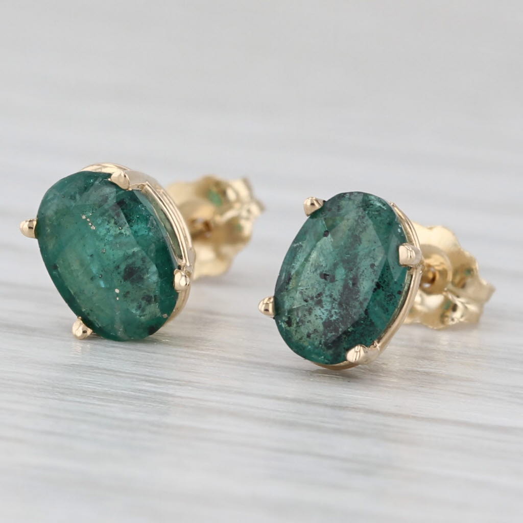 Light Gray 1.40ctw Oval Emerald Solitaire Stud Earrings 14k Yellow Gold