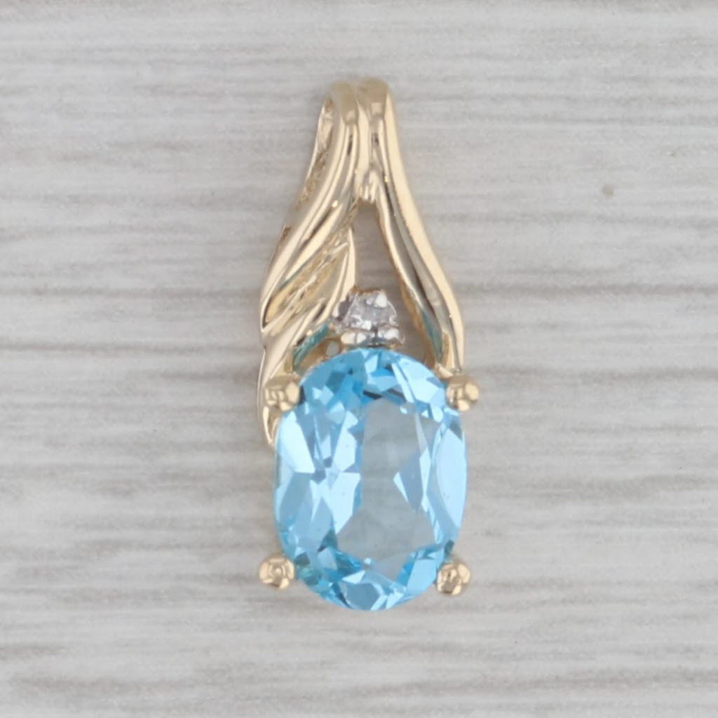 Gray 0.60ct Oval Blue Topaz Small Drop Pendant 10k Yellow Gold Diamond Accent