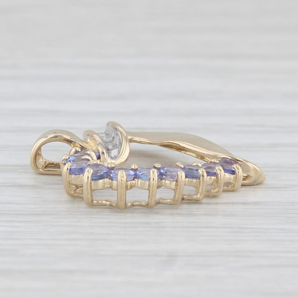 Light Gray 0.60ctw Tanzanite Open Heart Pendant 10k Yellow Gold Diamond Accents