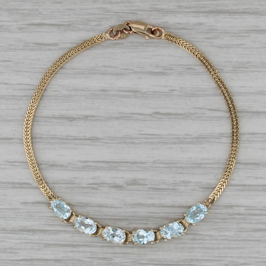 3.10ctw Blue Topaz Bracelet 14k Yellow Gold 6.5" Herringbone Chain