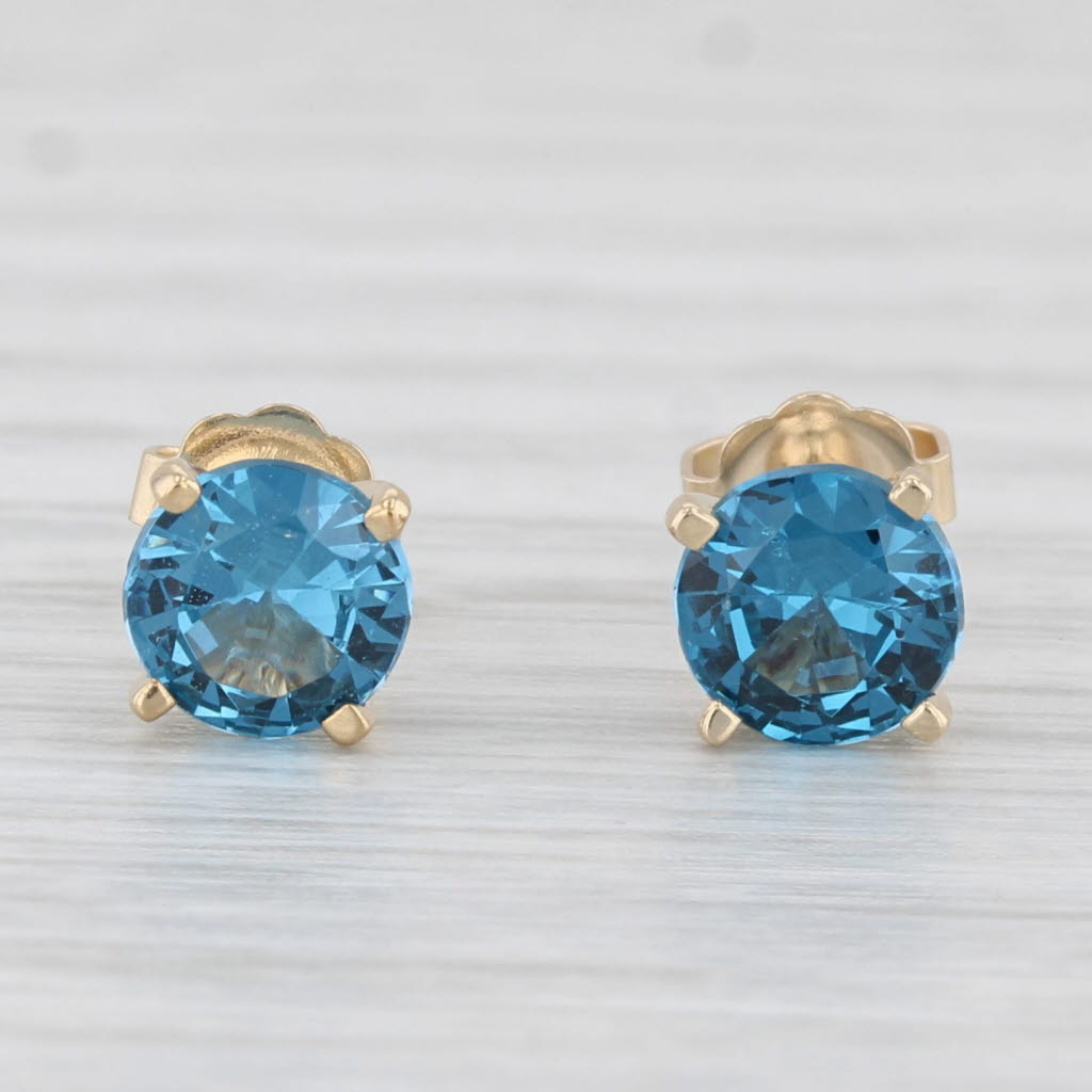 Light Gray 1.50ctw Lab Created Blue Spinel Stud Earrings 14k Yellow Gold