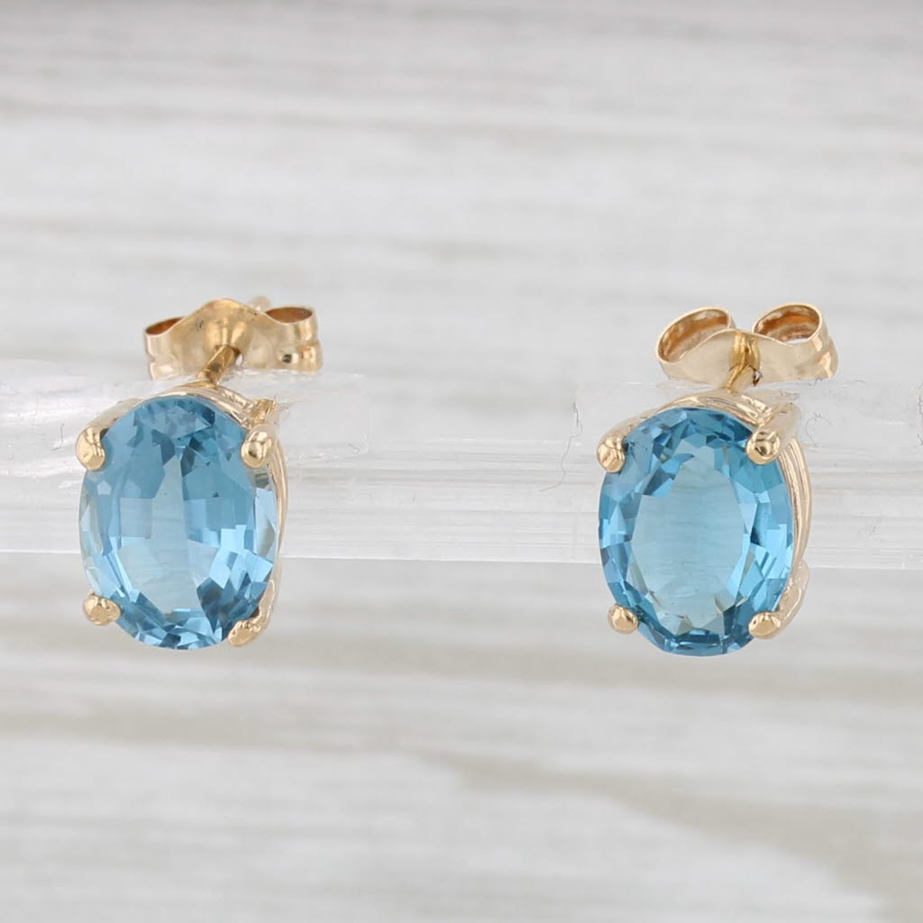 Light Gray 3.20ctw Oval Blue Topaz Solitaire Stud Earrings 14k Yellow Gold