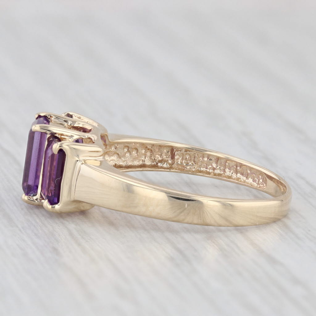 Light Gray 1.88ctw 3-Stone Emerald Cut Amethyst Ring 10k Yellow Gold Size 7.5