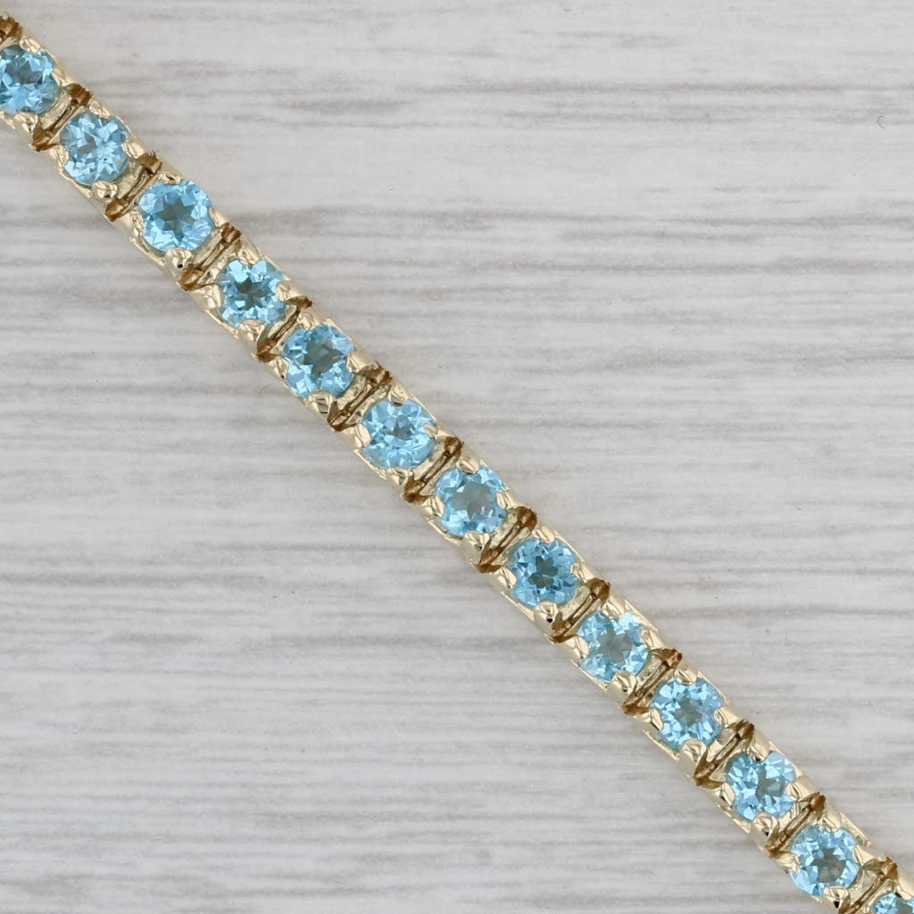 Gray 5.70ctw Blue Topaz Tennis Bracelet 14k Yellow Gold 7" 3.6mm