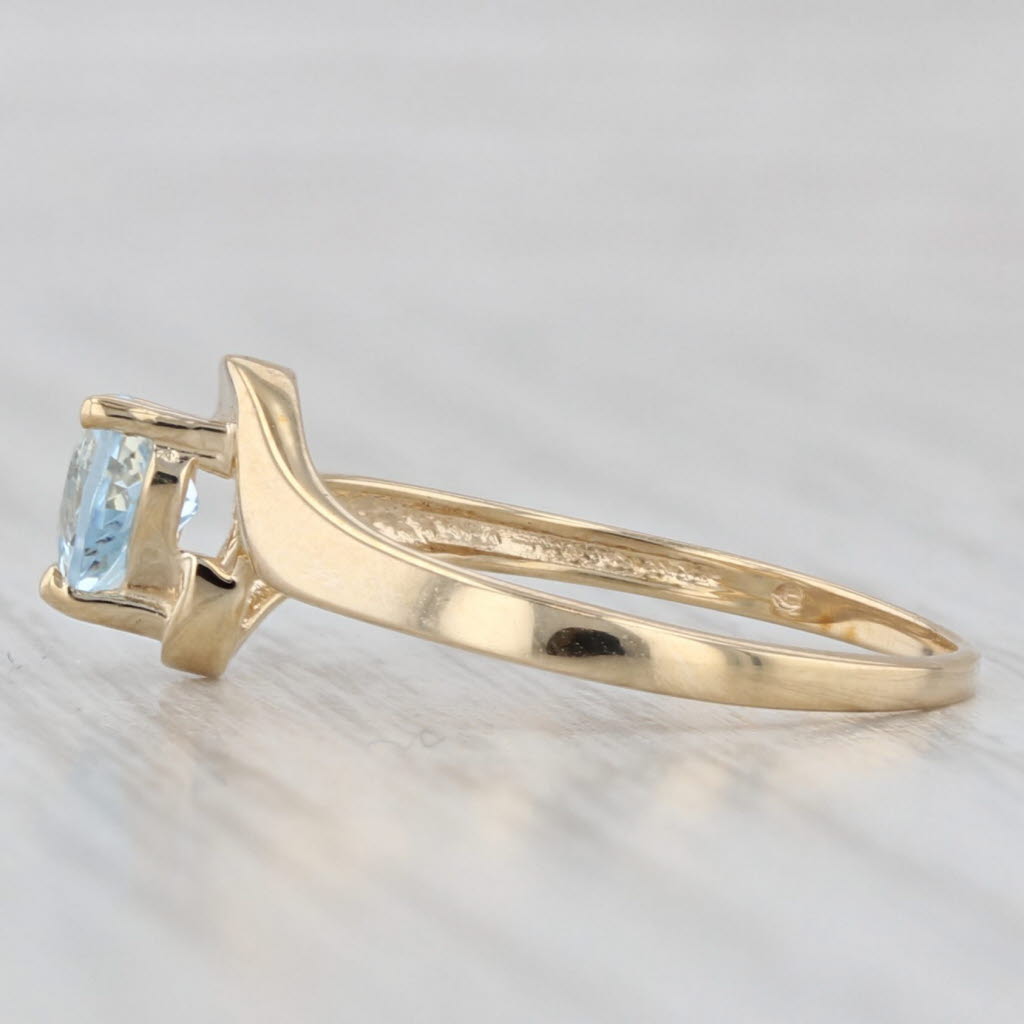 Light Gray 0.38ct Aquamarine Heart Bypass Ring 10k Yellow Gold March Birthstone Size 6.5