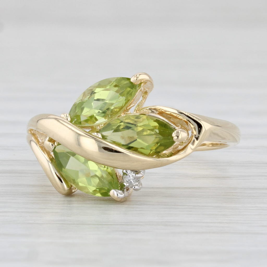 Light Gray 1.96ctw Peridot 3-Stone Ring 14k Yellow Gold Size 7.75 Diamond Accent