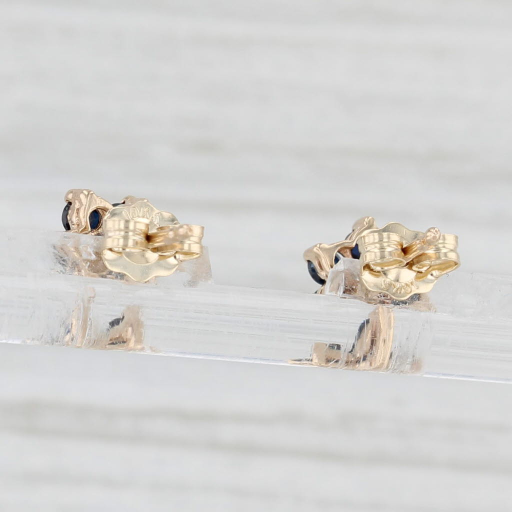 Light Gray 0.56ctw Blue Sapphire Flower Stud Earrings 10k Yellow Gold Diamond Accents