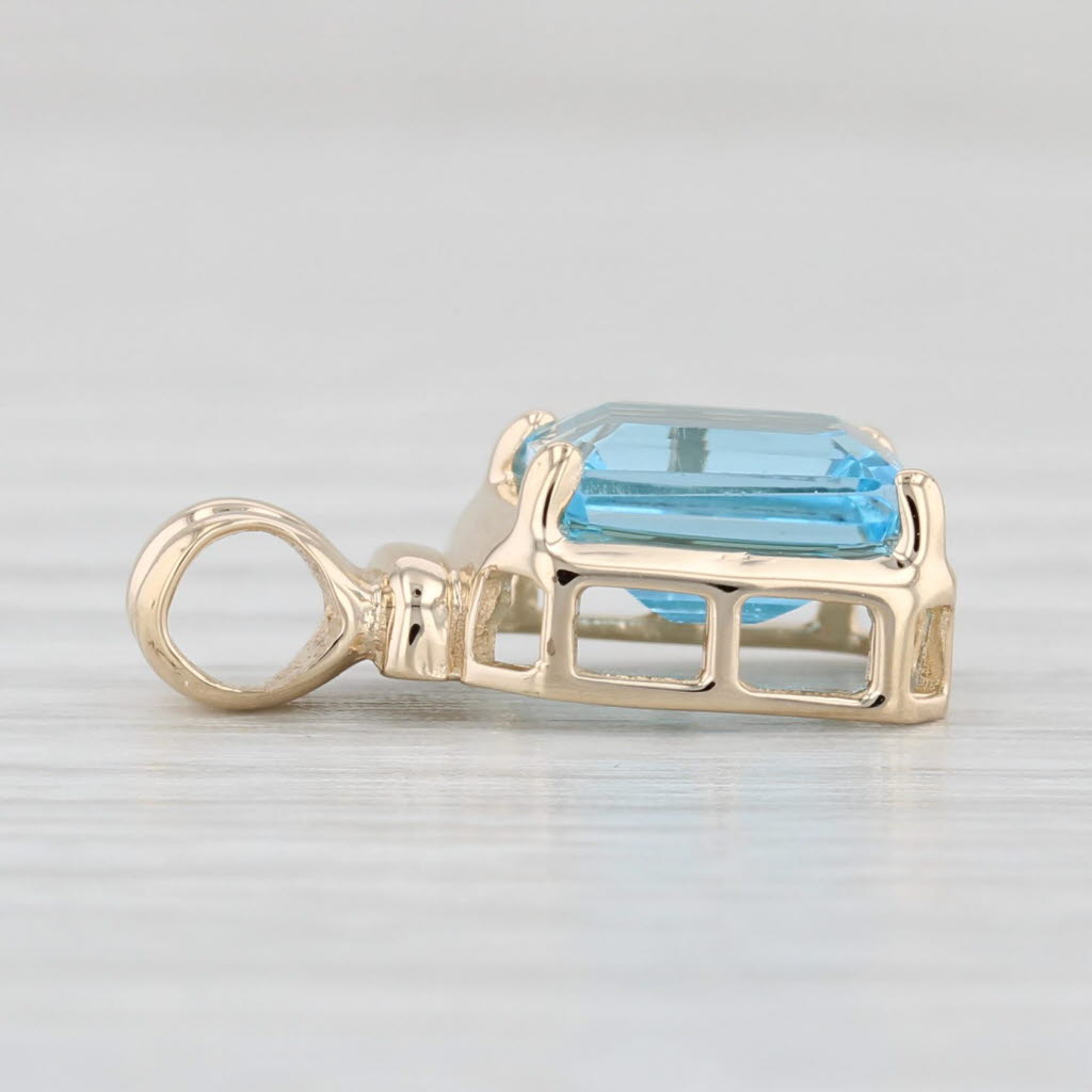 Light Gray 2.06ct Blue Topaz Solitaire Pendant 14k Yellow Gold Small Emerald Cut Drop