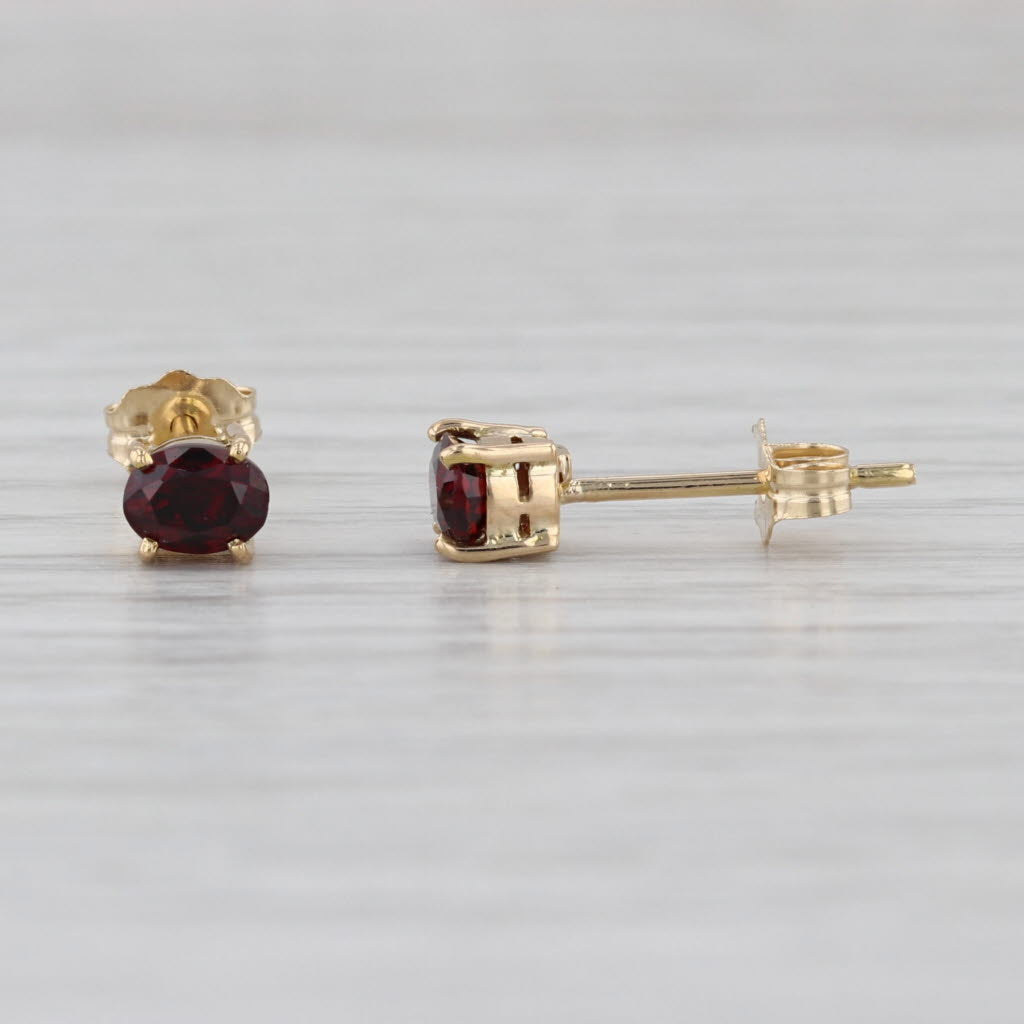 0.54ctw Lab Grown Ruby Stud Earrings 14k Yellow Gold Oval Solitaire Studs