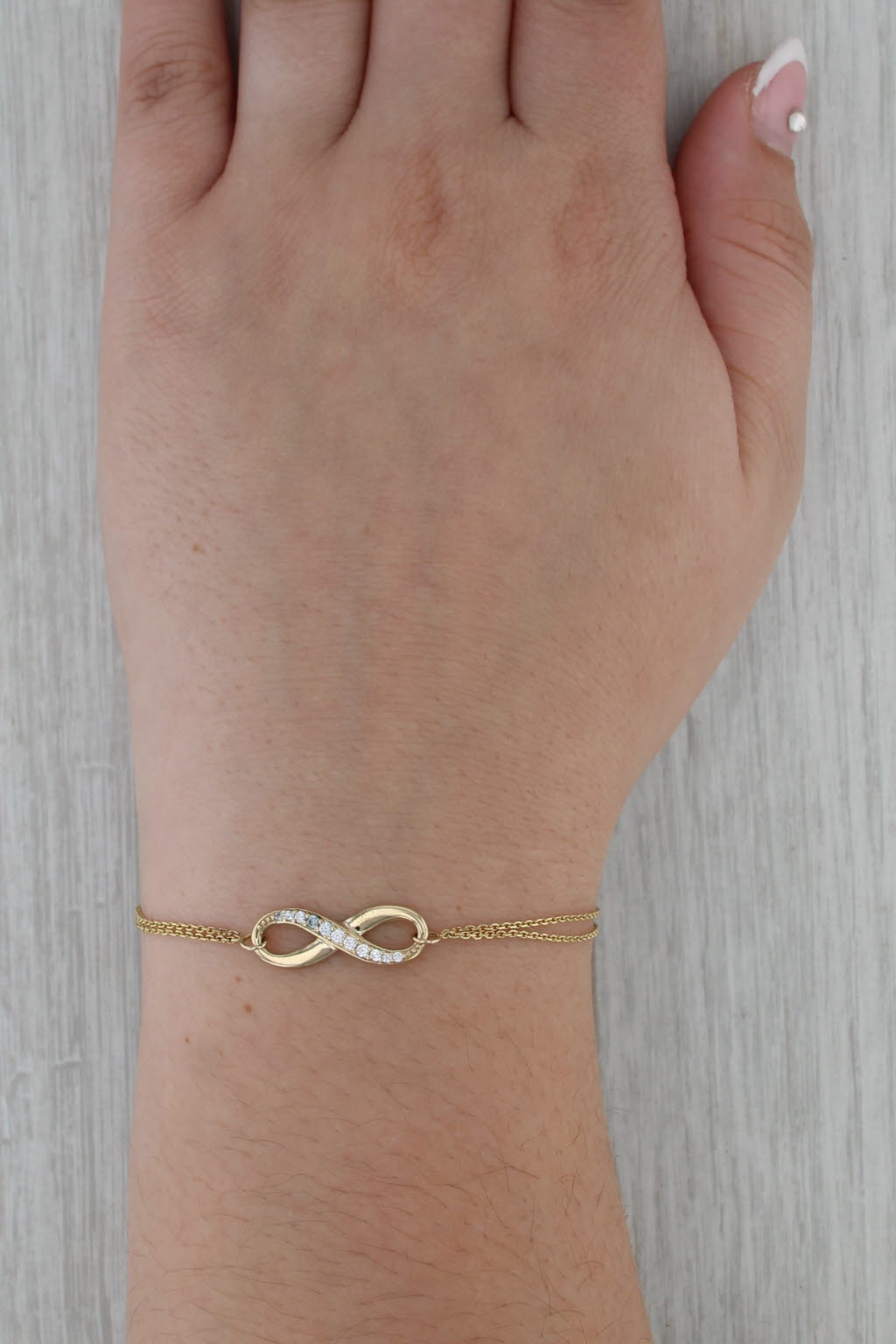 Cubic Zirconia Infinity Knot Bracelet 10k Yellow Gold 7-7.5" Cable Chain