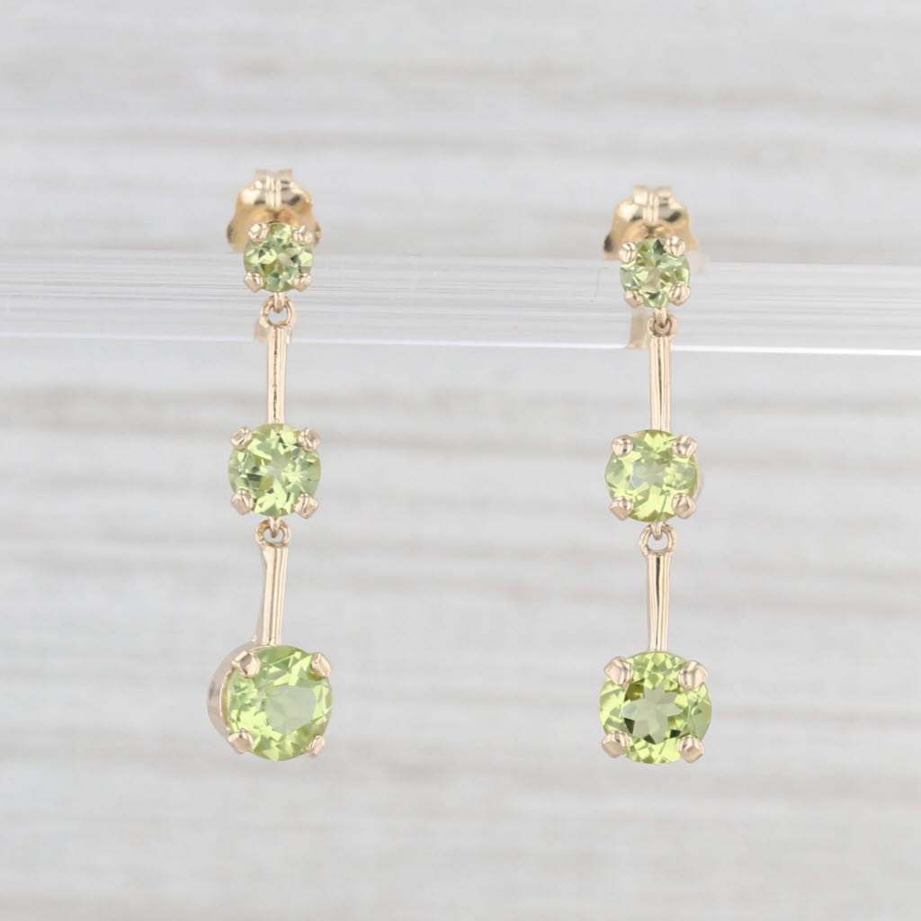 Light Gray 1.85ctw Peridot Graduated 3-Stone Dangle Earrings 10k Yellow Gold