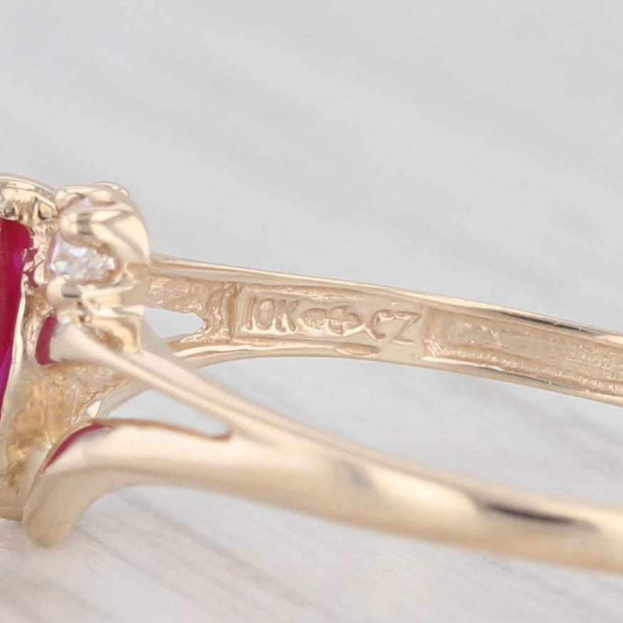 Light Gray 0.39ctw Lab Created Ruby Cubic Zirconia Ring 10k Yellow Gold Size 7 Bypass