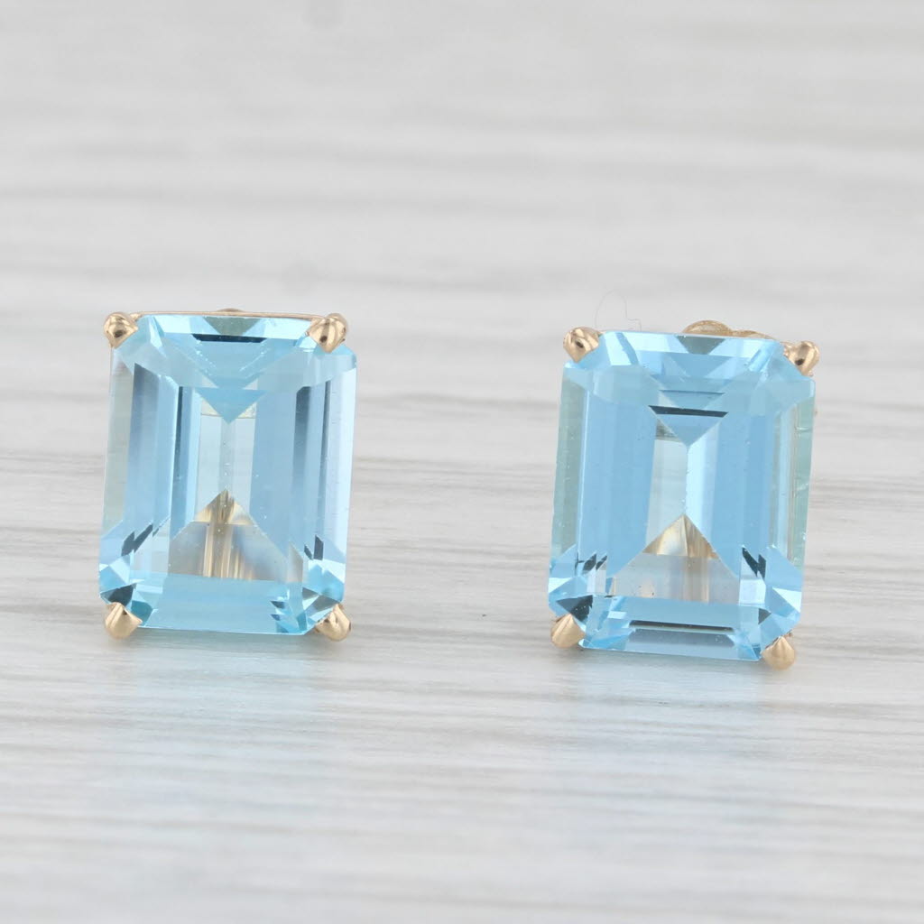 Light Gray 6ctw Blue Topaz Stud Earrings 14k Yellow Gold Emerald Cut Solitaires