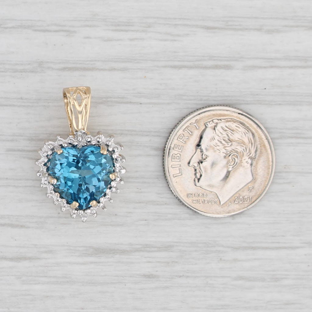 Light Gray 0.490ctw London Blue Topaz Heart Diamond Halo Pendant 10k Yellow Gold