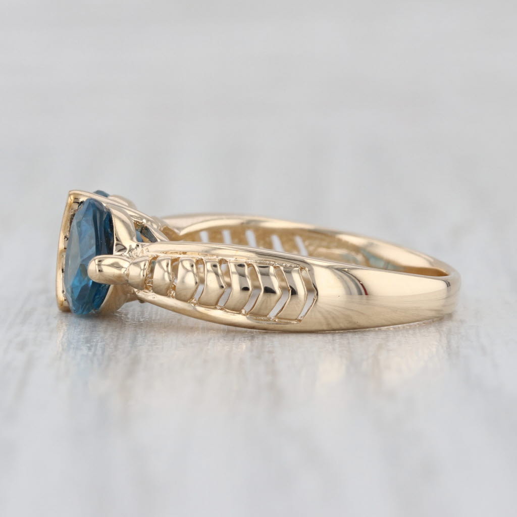 2.80ctw Blue Topaz Hearts Ring 10k Yellow Gold Size 7.25 Beveled Band