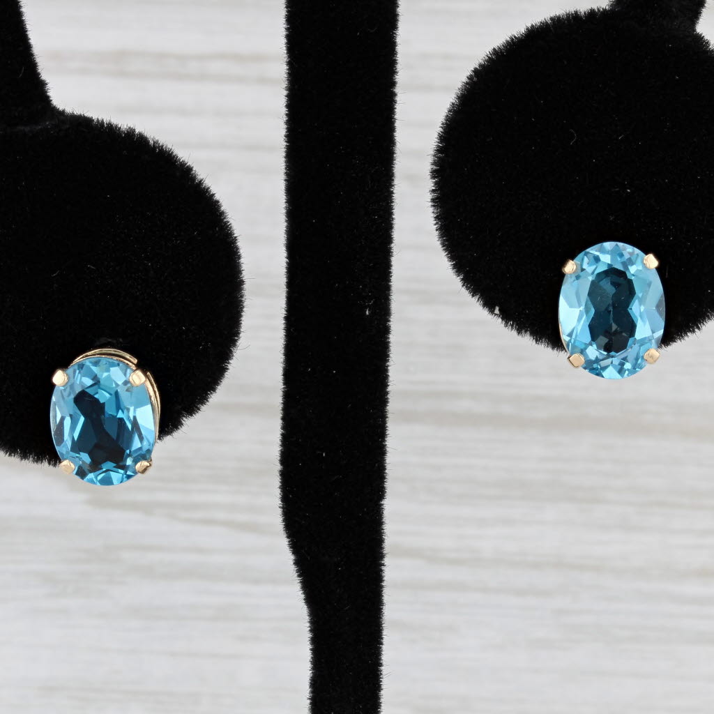 Light Gray 4ctw Oval Blue Topaz Stud Earrings 14k Yellow Gold