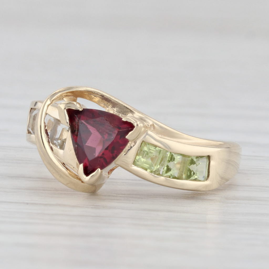 Light Gray 1.11ctw Garnet Peridot Topaz Bypass Ring 10k Yellow Gold Size 6.75