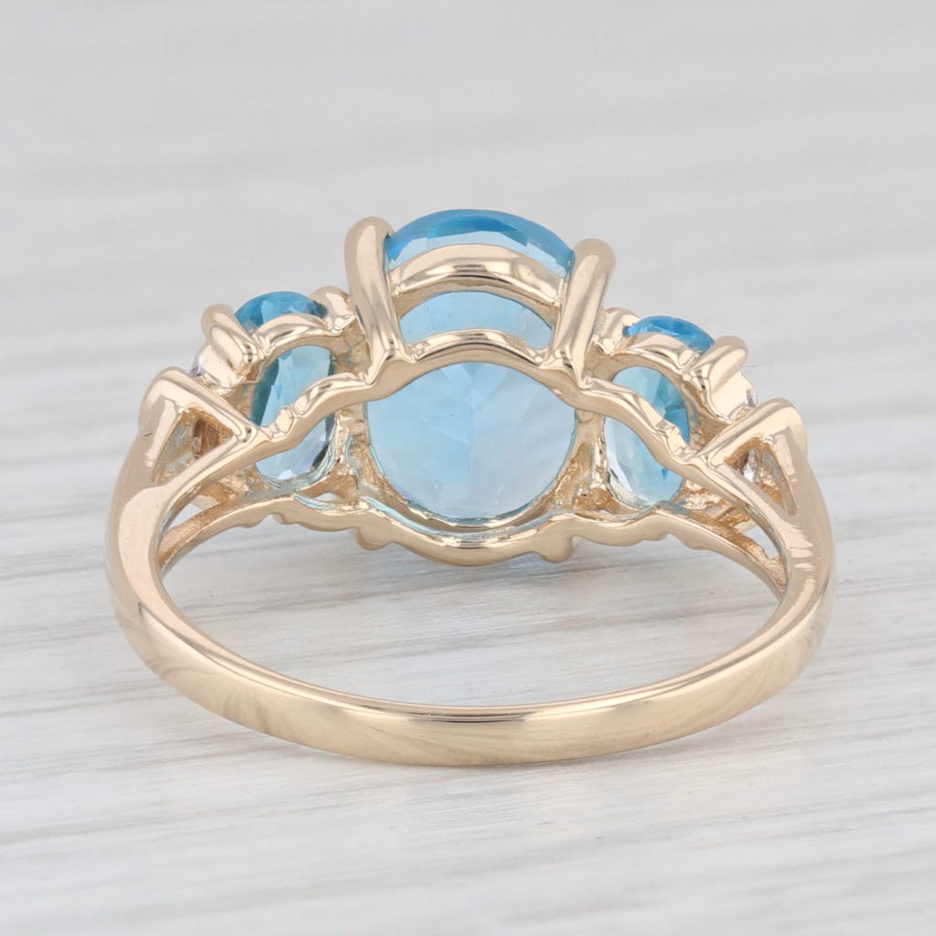 Light Gray 4.48ctw Oval Blue Topaz Ring 14k Yellow Gold Diamond Accents Size 7