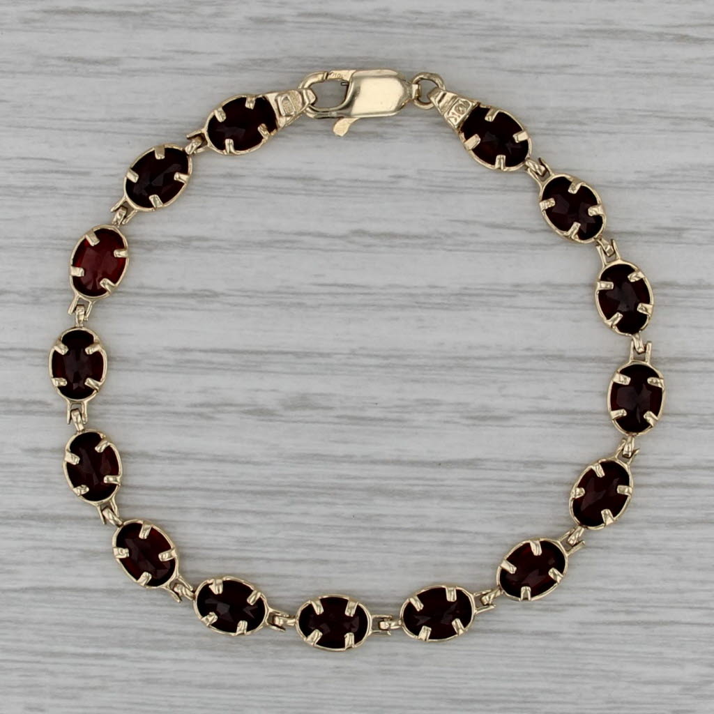 13ctw Garnet Tennis Bracelet 10k Yellow Gold 7" 6.3mm Oval Links