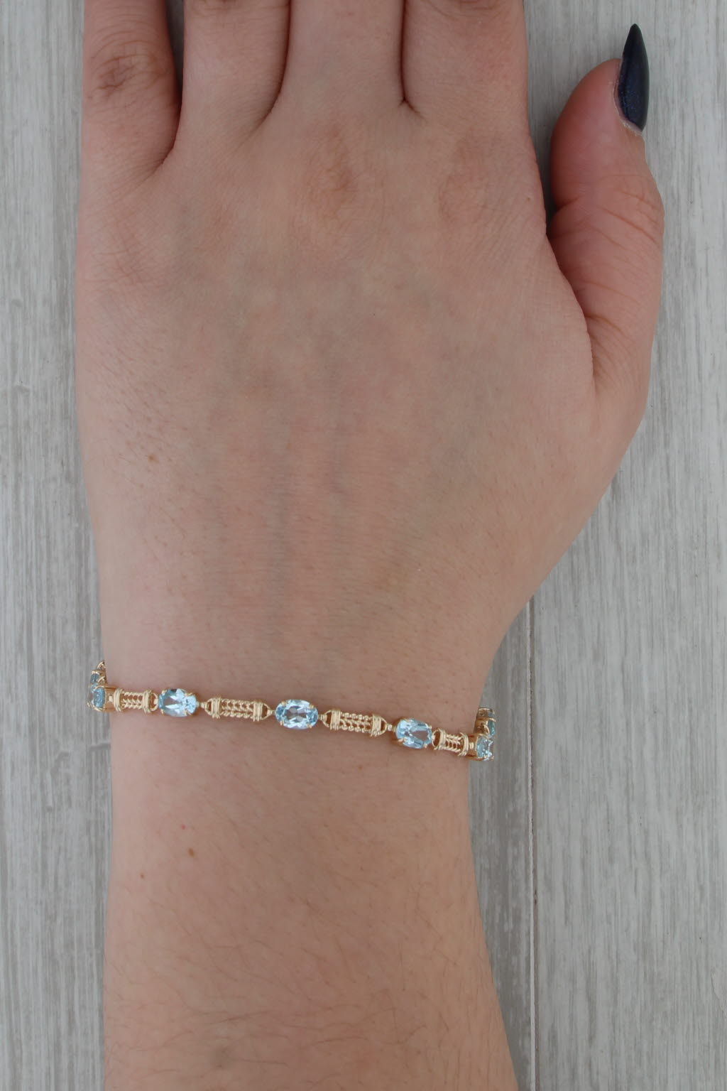 5.10ctw Blue Topaz Tennis Bracelet 10k Yellow Gold 7" 4.3mm