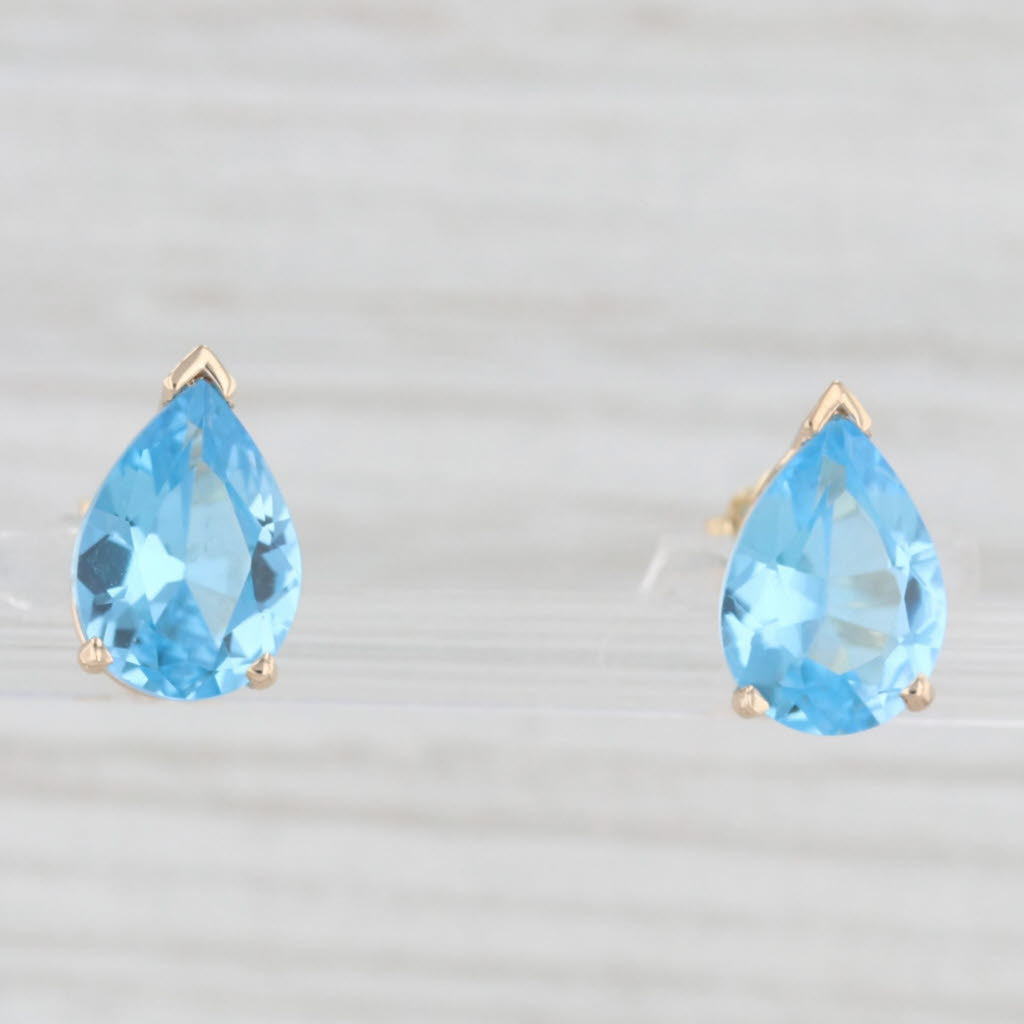 Light Gray 5ctw Pear Solitaire Blue Topaz Stud Earrings 14k Yellow Gold