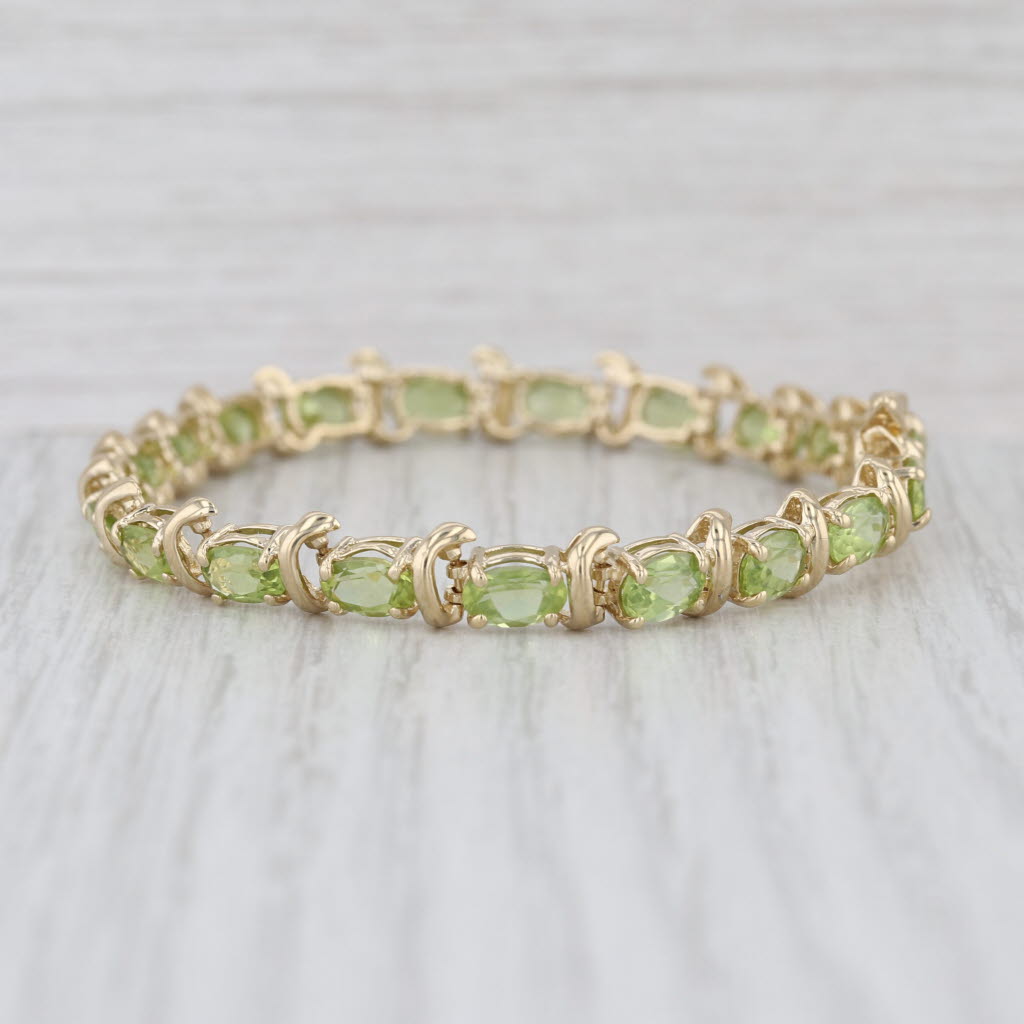 10ctw Light Green Peridot Tennis Bracelet 14k Yellow Gold 6.75" 6.4mm