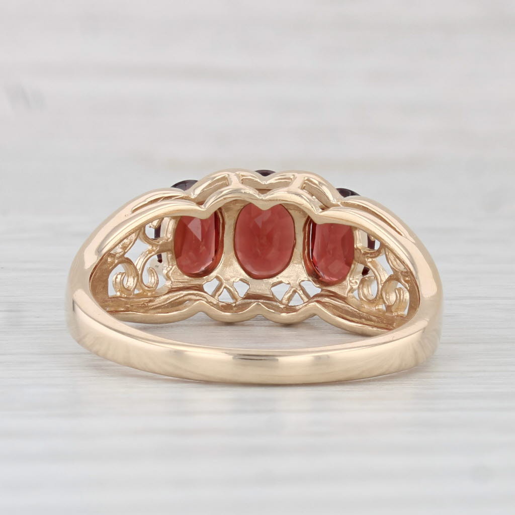Light Gray 2.10ctw Oval Garnet 3-Stone Ring 14k Yellow Gold Size 8