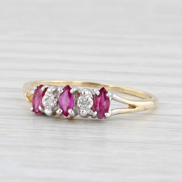 0.30ctw Marquise Ruby 3-Stone Ring 10k Yellow Gold Size 5.25 Diamond Accents