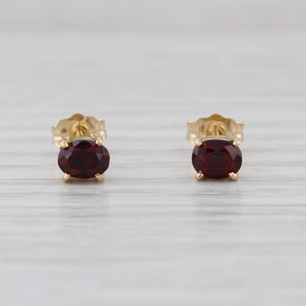 0.54ctw Lab Grown Ruby Stud Earrings 14k Yellow Gold Oval Solitaire Studs