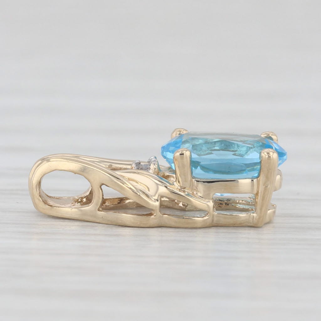 Light Gray 0.60ct Oval Blue Topaz Small Drop Pendant 10k Yellow Gold Diamond Accent