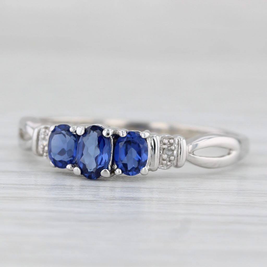 Light Gray 0.95ctw Lab Created Sapphire 3-Stone Ring 10k White Gold Size 9 Diamond Accents