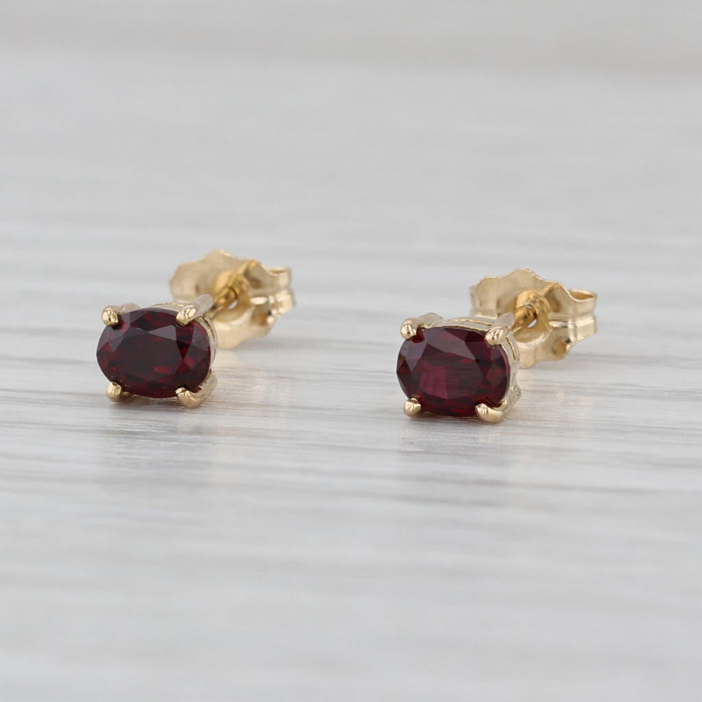 0.54ctw Lab Grown Ruby Stud Earrings 14k Yellow Gold Oval Solitaire Studs