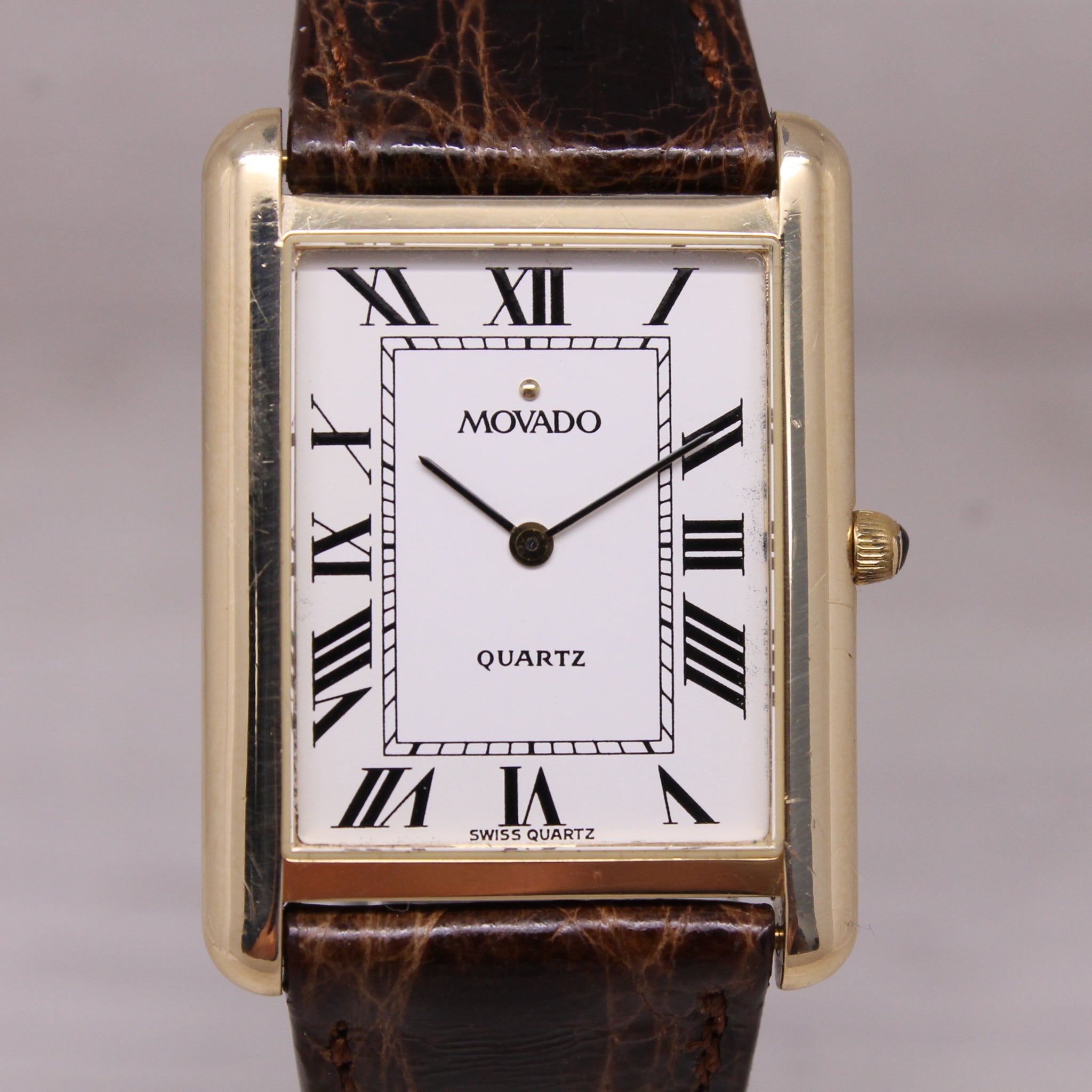 Vintage c.1990 Movado 14k Yellow Gold 25mm Tank Dress Watch Quartz Roman Dial