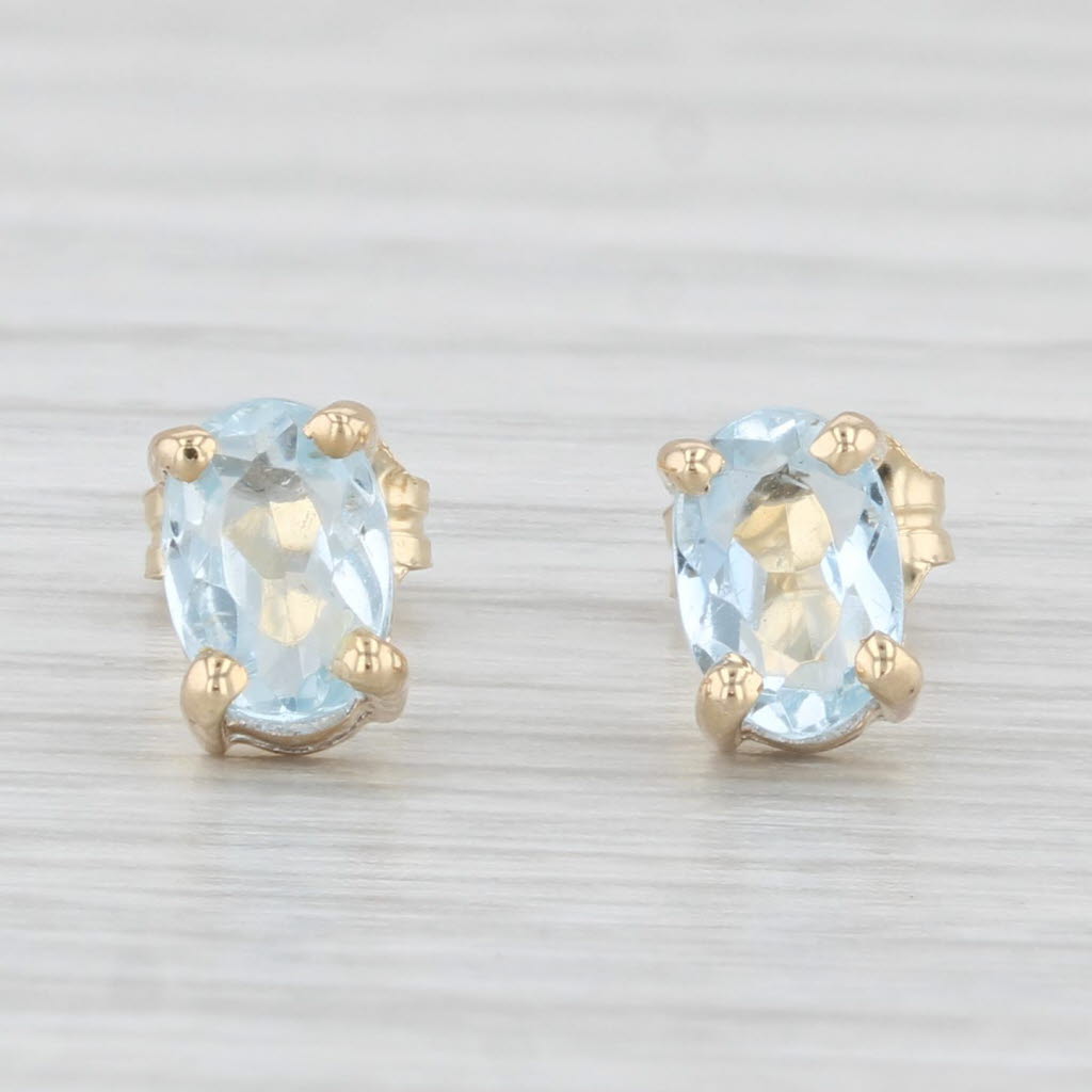 Light Gray 0.80ctw Aquamarine Stud Earrings 14k Yellow Gold Oval Solitaires