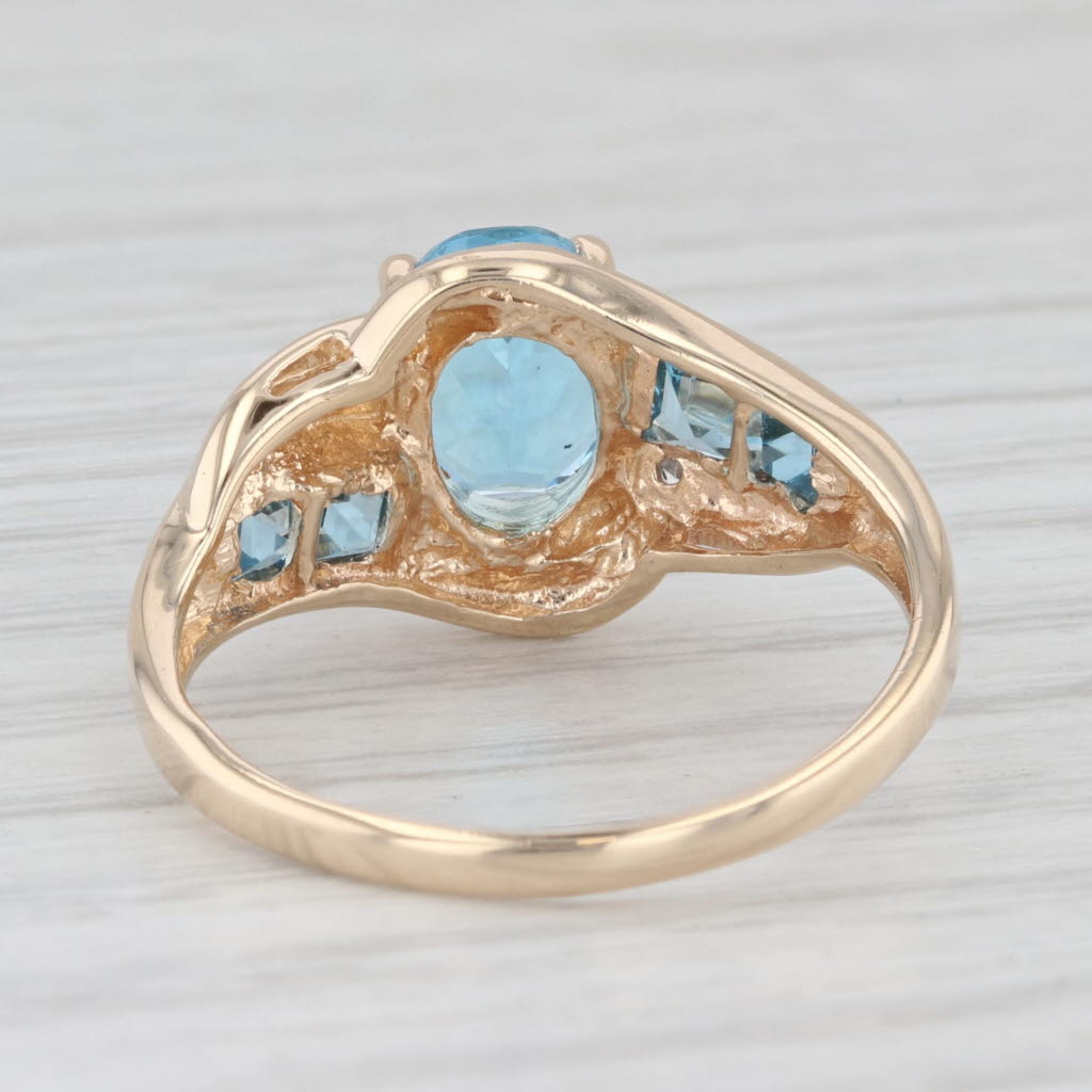 Light Gray 2.30ctw Oval Blue Topaz Bypass Ring 10k Yellow Gold Size 7.25 Diamond Accents