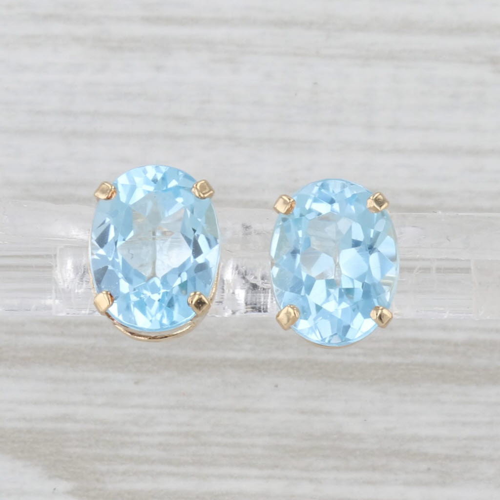 4.30ctw Oval Blue Topaz Stud Earrings 14k Yellow Gold Solitaire Studs