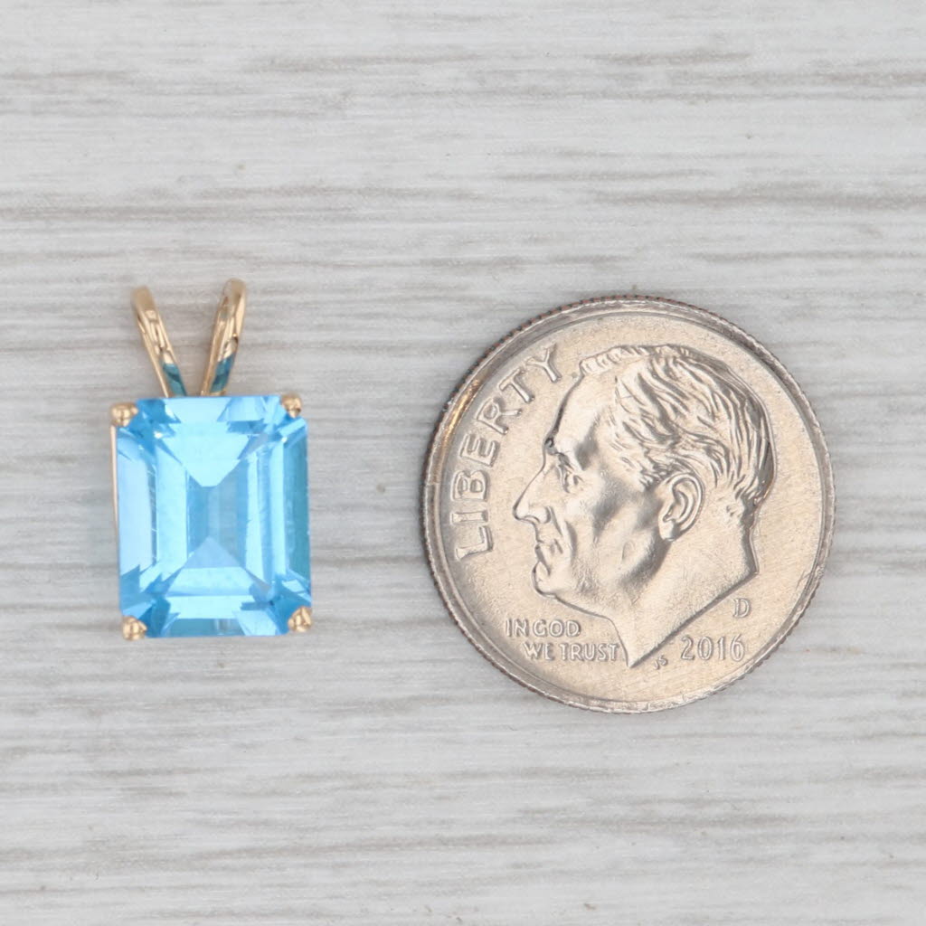 Light Gray 4.25ct Blue Topaz Emerald Cut Solitaire Pendant 14k Yellow Gold