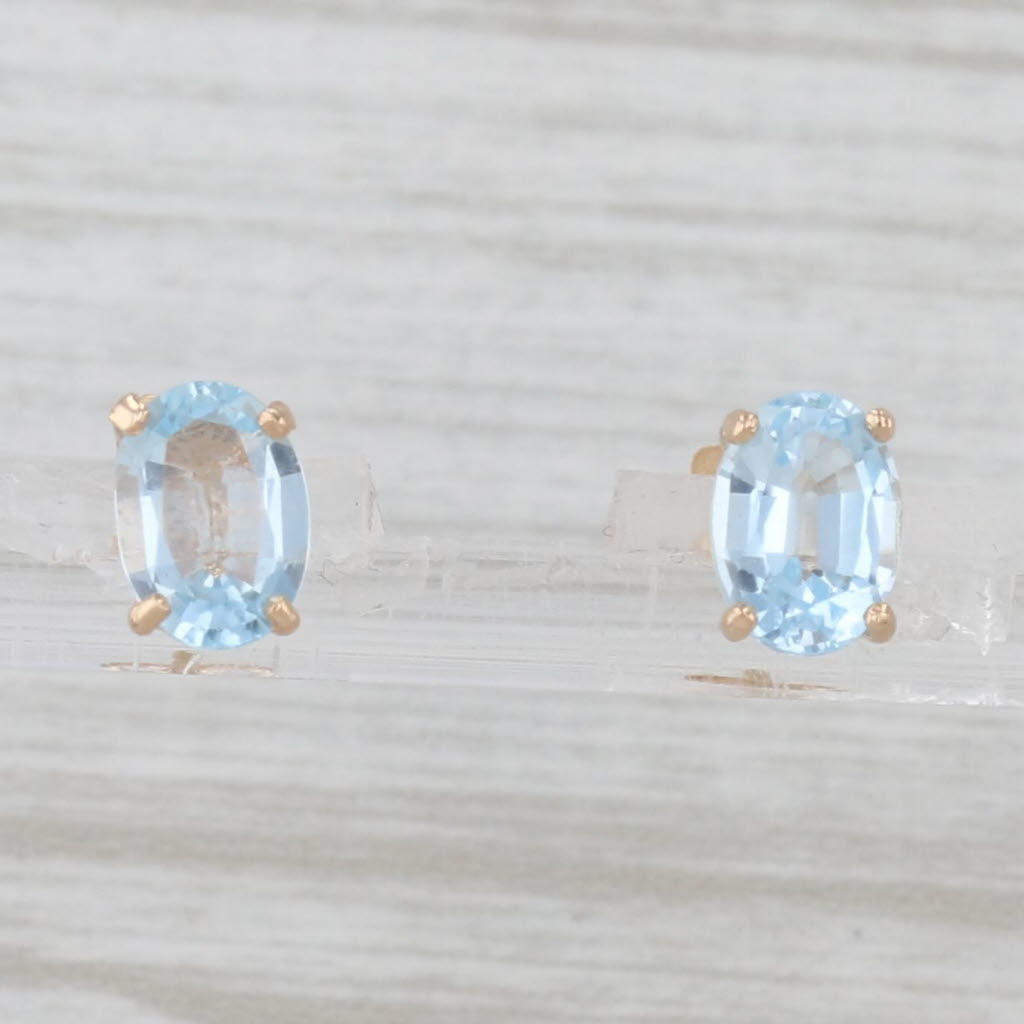 Light Gray 2ctw Oval Blue Topaz Solitaire Stud Earrings 14k Yellow Gold