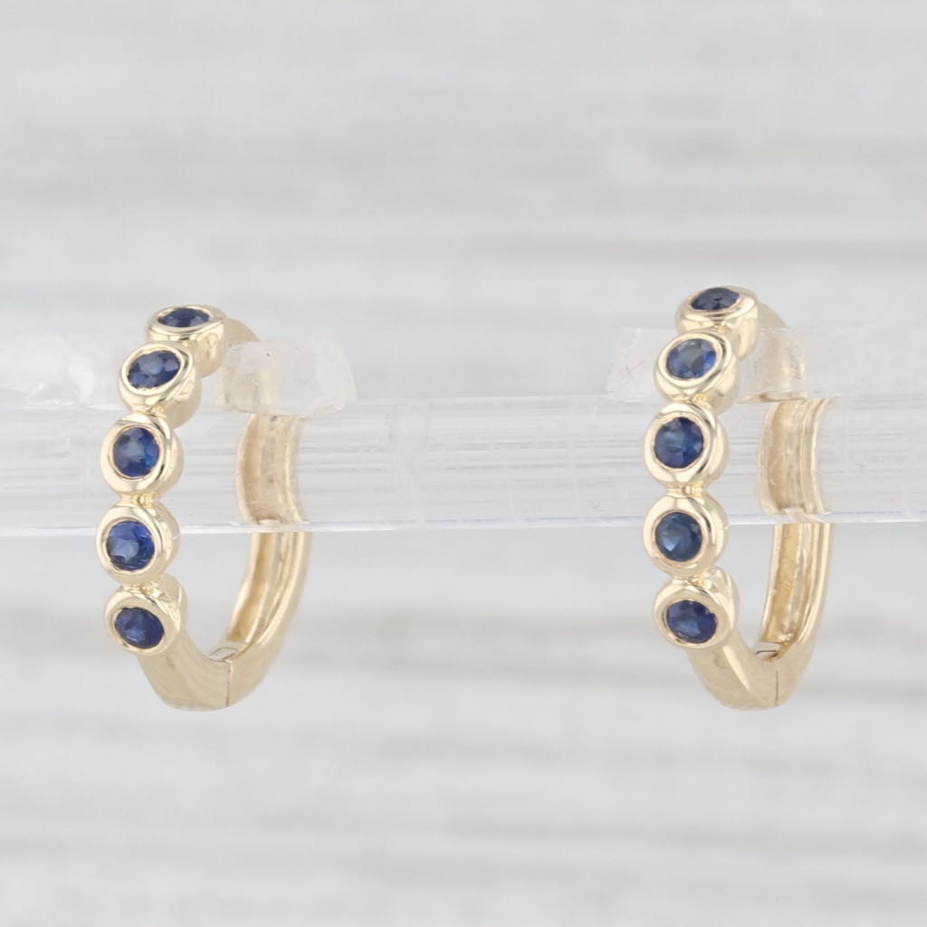 Light Gray New Blue 0.10ctw Sapphire Hoop Huggie Earrings 10k Yellow Gold Round Hoops