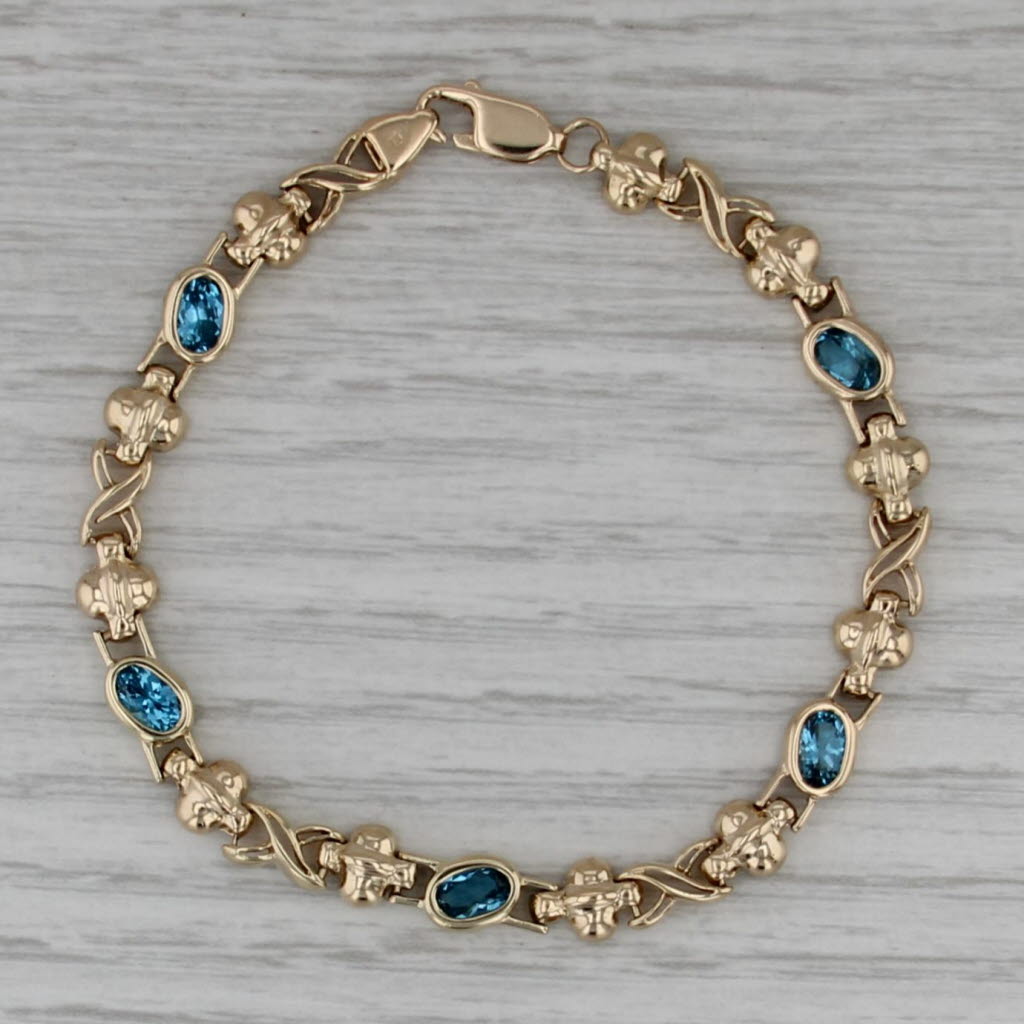 2.68ctw Blue Topaz Infinity Knot Bracelet 14k Yellow Gold 6.75" 6mm