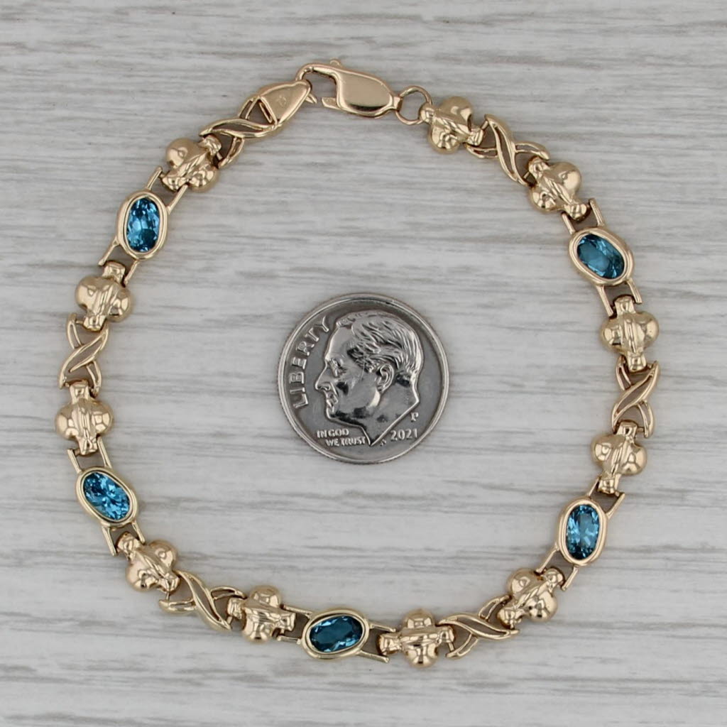 2.68ctw Blue Topaz Infinity Knot Bracelet 14k Yellow Gold 6.75" 6mm