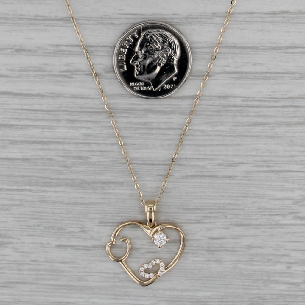 0.15ctw Moissanite Stethascope Heart Pendant 14k Yellow Gold 16-18" Cable Chain